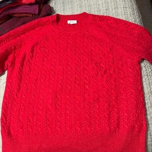 On 34th crew neck 1x red cable knit sweater.